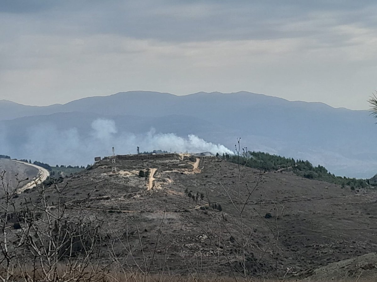 The photo of one of the woods surrounding the Israeli Honin barrack was taken in the early morning. The cause of the smoke is the fall of a flare bomb fired by the Israeli at night and the winds pushed it into the territory.