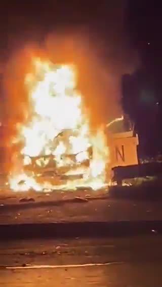 Hezbollah militia followers smash and burn cars heading to Beirut airport, and assault passersby