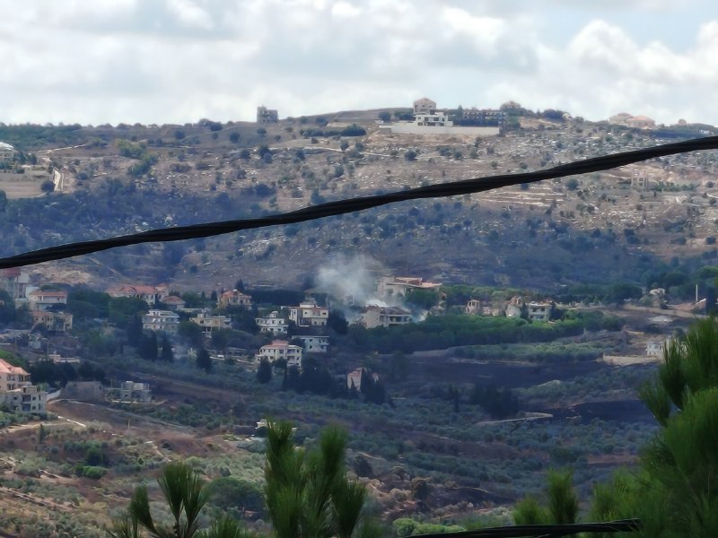 An artillery shell targeted a house on the outskirts of the town of Aita al-Jabal.